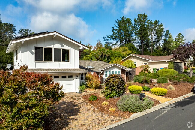 This Ivy Drive gem blends classic architecture with modern updates and colorful, low-maintenance landscaping.