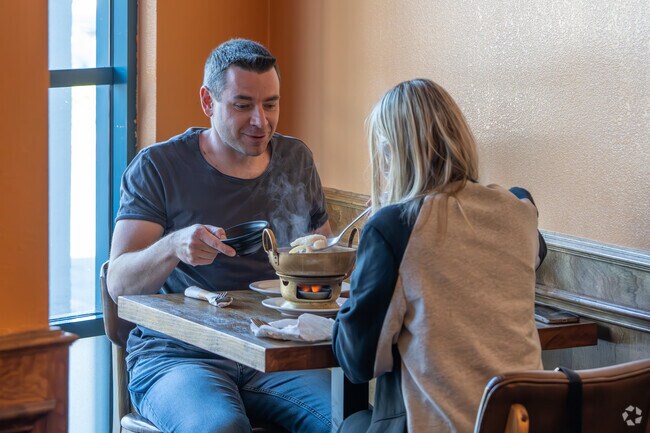A couple enjoys a serving of Thai style soup at Similan Thai.