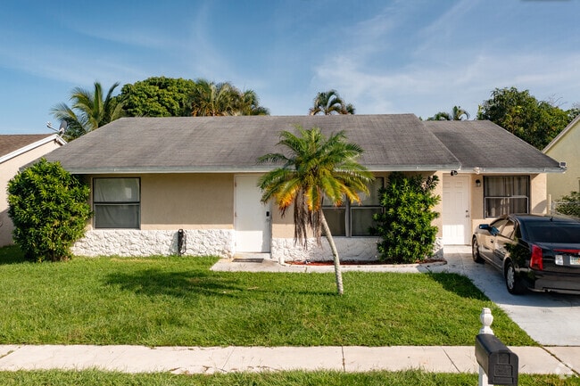 A simplistic Ranch style home in the Pine Air neighborhood of Palm Springs, FL.