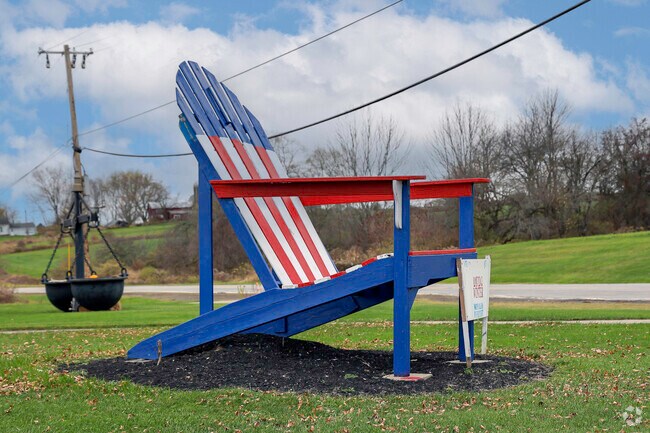 A massive red, white and blue chair in Collins.