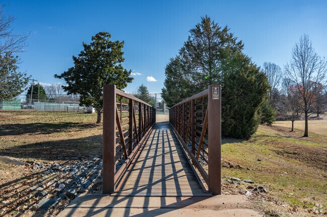 Cool bridge that leads to tennis and pickleball courts at Oak Summit Park.