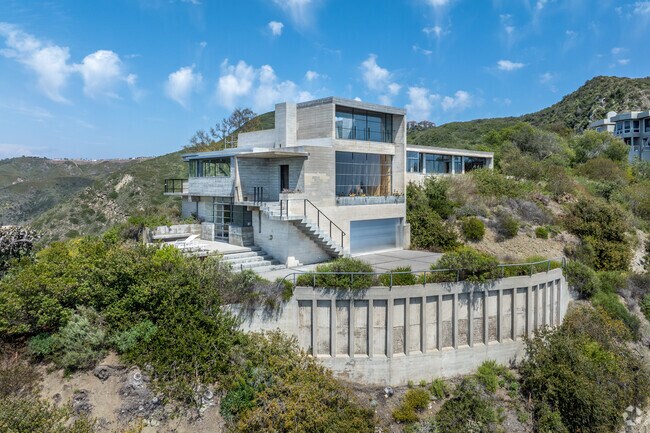 At the top of the peak in Coast Royal, you'll find expansive modern homes that offer cutting-edge design, sweeping ocean views, and unparalleled luxury living.