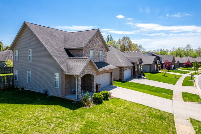 Newer constructed homes line a neighborhood street in Oak Grove.