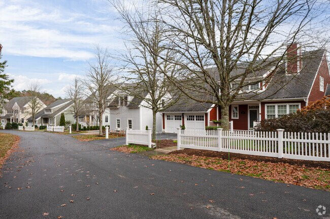 White picket fences and two-car garages are common in Pinehills Golf Club.