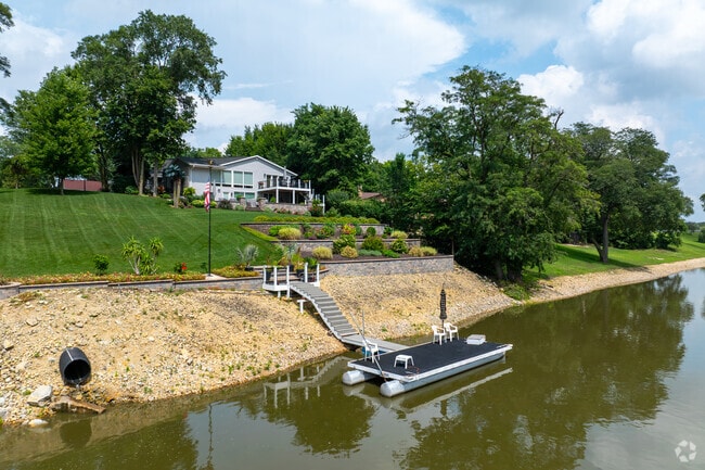 A riverfront property with a large backyard and private boat dock.