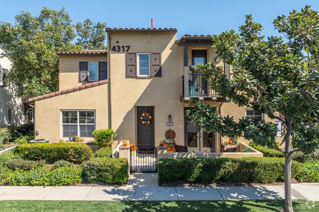 Stylish Spanish townhomes are seen in Dos Lagos.