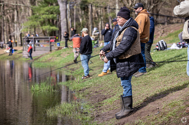 Opening day of trout season draws a large crowd to Stratton Brook State Park in Simsbury.