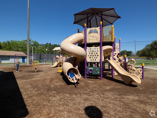 The kids are having fun playing at Tom Marshall Park.
