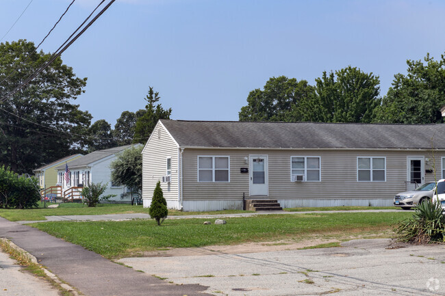 Homes in the Poquonnock Bridge neighborhood are frequently plain duplexes like this row.