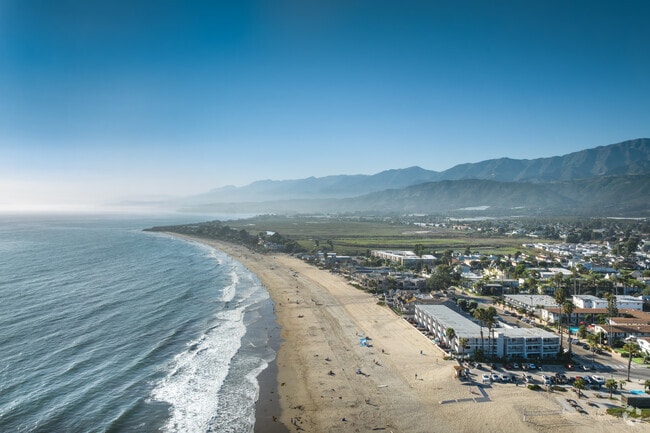 A hazy aerial view looking up the coast from Carpinteria.