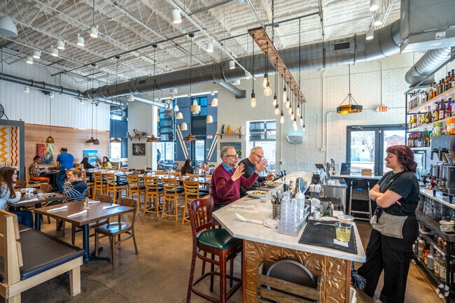 Southside residents enjoy fresh baked goods like pizza and bagels at Honey Seed.