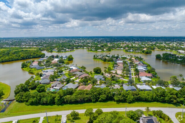 Aerial overview of homes in Sancturay at Sawgrass Lakes gated community of Sawgrass Lakes.