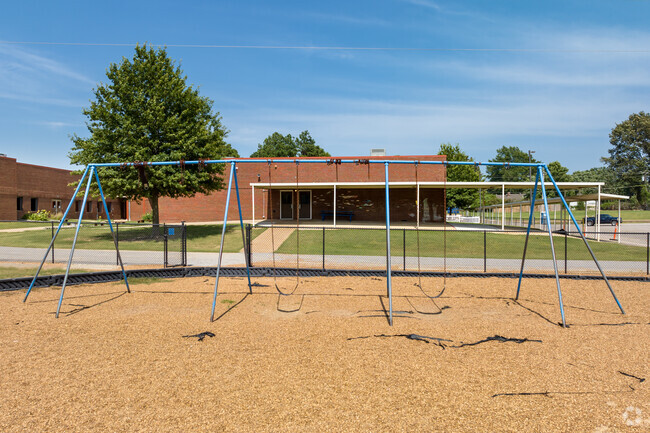 There are swings on the playground at Chickasaw Elementary School in Olive Branch.
