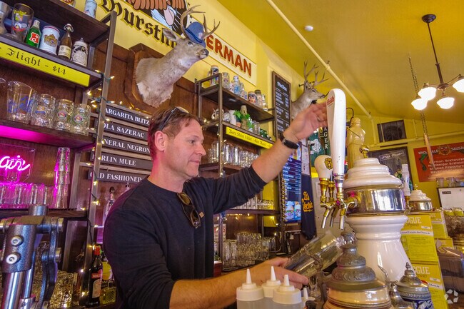 The Urban German pours a pint of ale at happy hour in  the Cathedral Park Neighborhood.