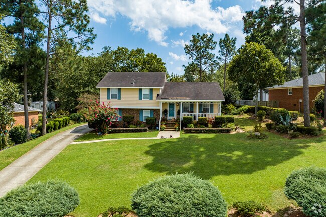 Split-level homes sit on lots with mature shade trees.