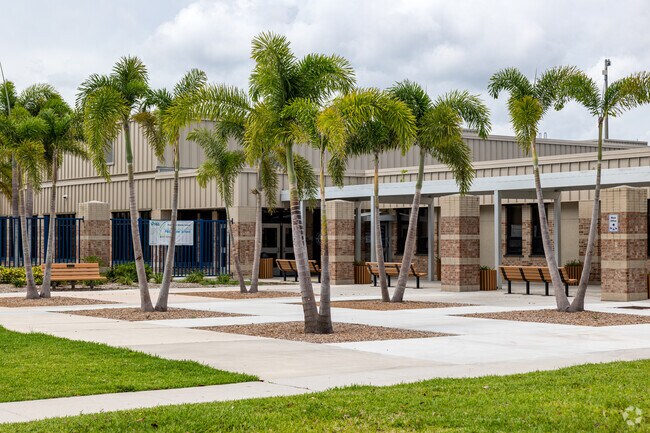 Pine Ridge Middle School in Naples features a central seating area lined with palm trees.