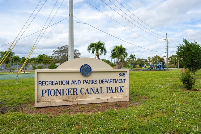 Pioneer Canal Park offers serene trails and picnic spots.