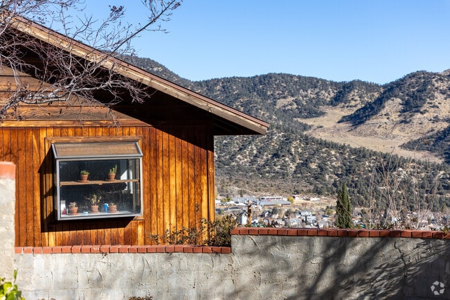 Close-up of a wooden-panel home with a valley view in Frazier Park