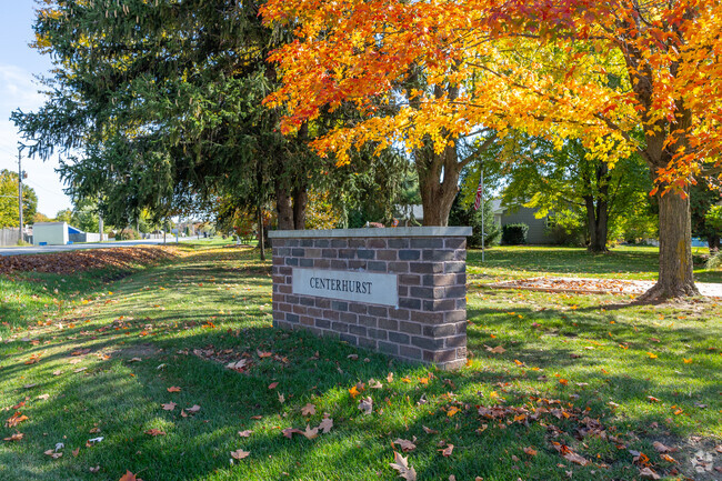 Centerhurst neighborhood sign surrounded with colorful trees.