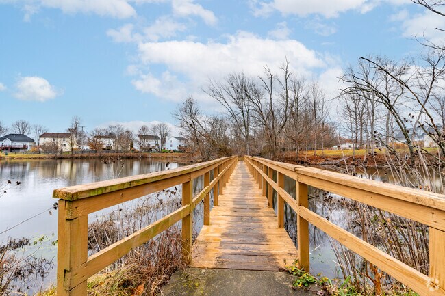 A long wooden bridge invites walkers out over the water at Wilborn Park.