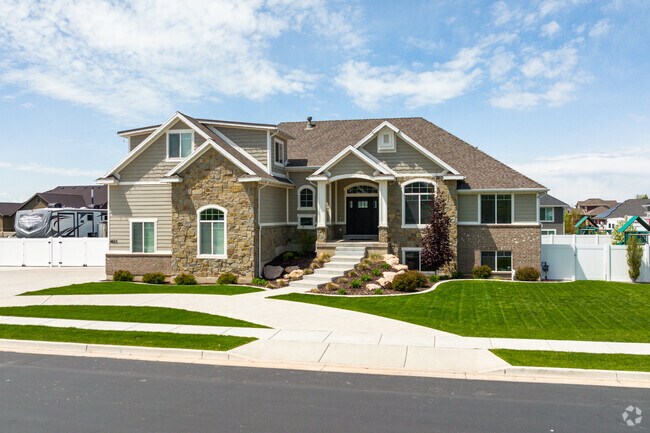 A new home in Hooper would typically feature modern amenities and design elements, with a well-manicured lawn and landscaping.