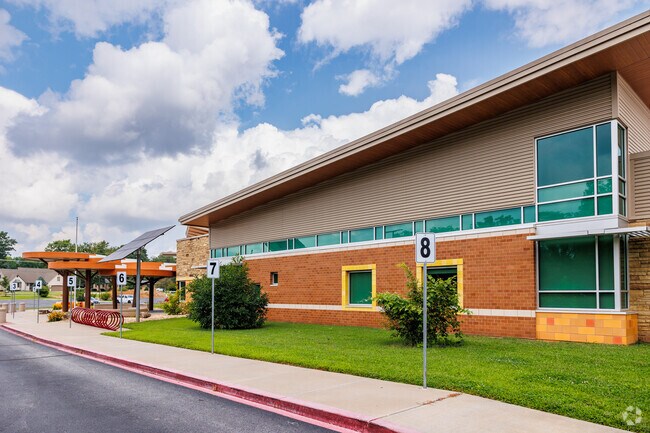 Sherwood Elementary School is set in a wooded area along South Creek.