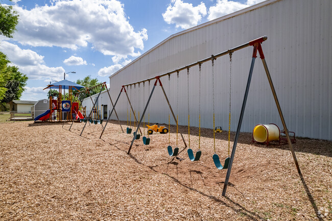 Kids enjoy the swing set at Praise Temple Christian Academy.