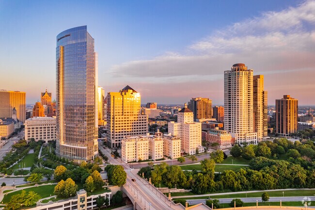 Condos and office towers reflect the sunset in East Town.