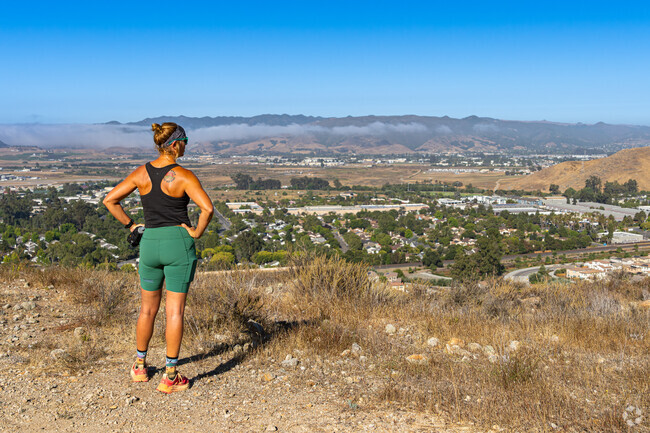 An Orcutt jogger takes time to enjoy the view from the top of Rigetti Hill.