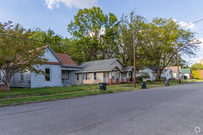 Green grassy lots dot the landscape of Farley Place.