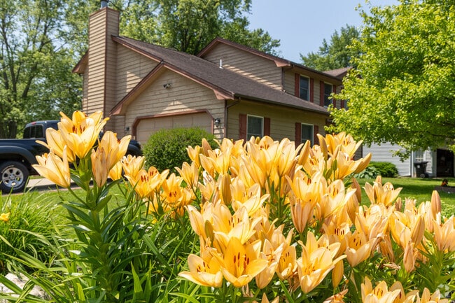 Neighbors of Parkside decorate their lawns near the sidewalks with flowers.