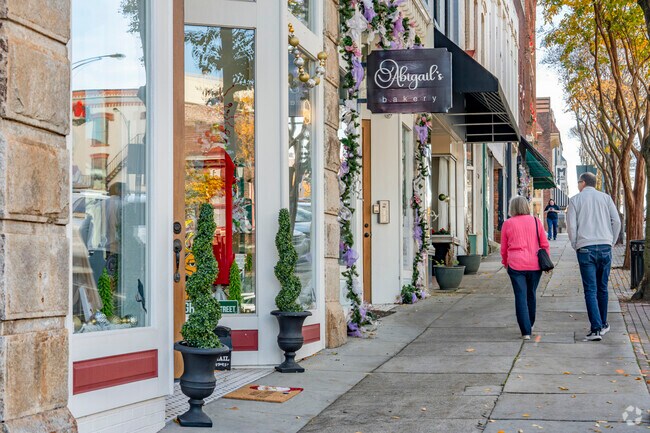 Visitors stroll along the small locally owned business storefronts of Salisbury's Main Stree