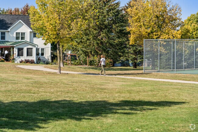 Younge Park provides fun for all with tennis courts, a playground, and peaceful walking trails.