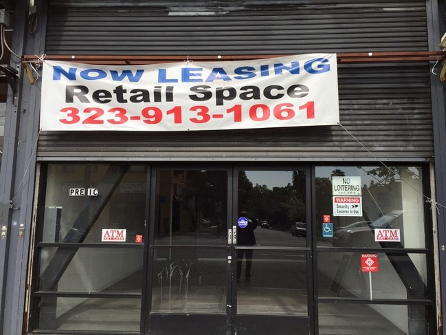 Street frontage entrance.Metal roll up door half way down