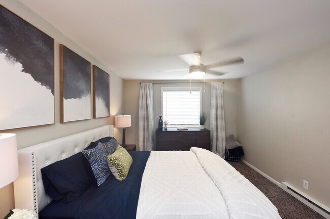 Experience serene comfort in this beautifully designed bedroom oasis.