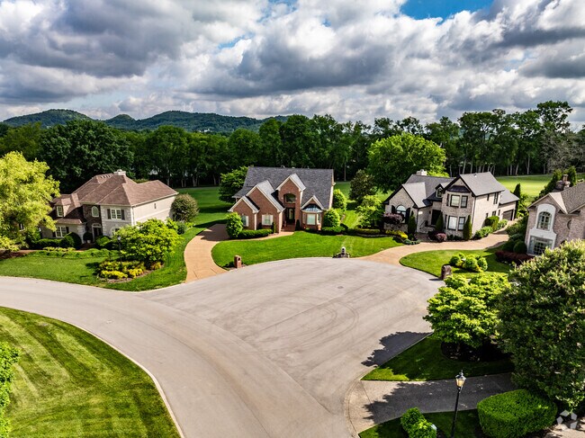 There are larger homes with lush landscaping in the Brentwood Neighborhood.