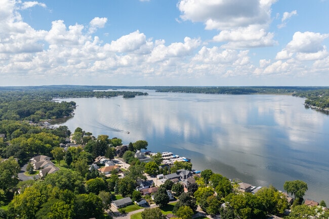 Residential streets in Pewaukee Village are surrounded by natural beauty just steps from the homes.