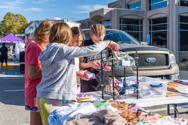 Residents offer locally-produced food and treats at the Cedar Falls Farmers Market.