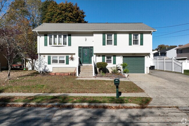 Explore a charming raised ranch home located in Greenwood, Rhode Island.