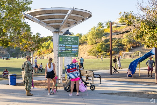 These parents are checking out the event board at the 4S Ranch Sports Park in 4S Ranch.