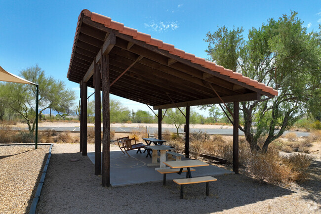 There is a shaded seating area near the playground at Trinity Christian School in Mesa.