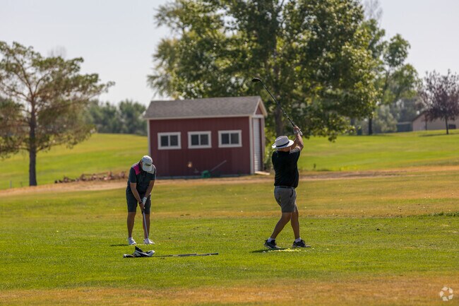 Golf enthusiasts enjoy a sunny day on North West Helena's Bill Roberts Golf Course.