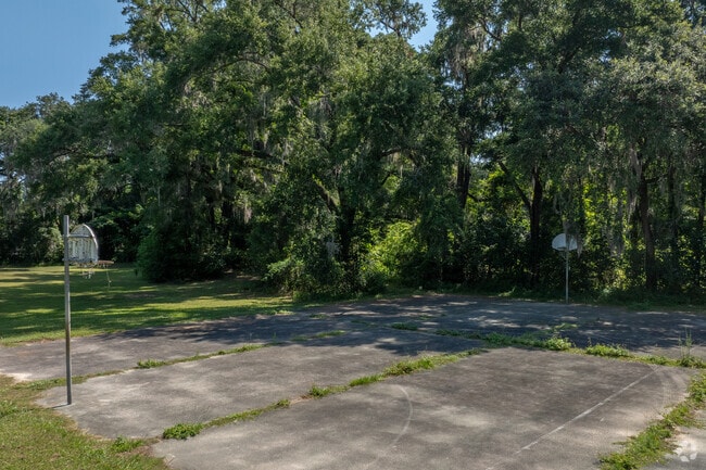 Students enjoy the shaded basketball courts at Alachua Elementary School.