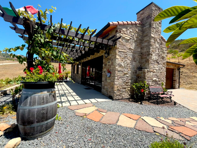 Main entrance to stone villa with private garage, patio, spa—breathtaking views!