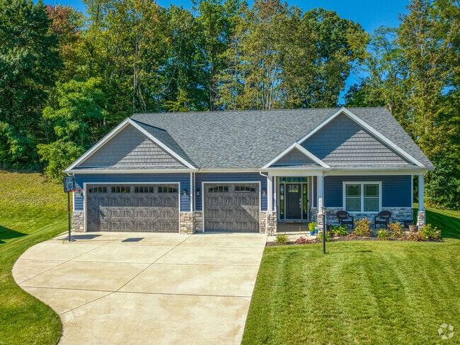 Single-family homes in Forward Township often have large paved driveways and well-kept lawns.