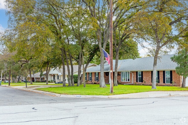 Many homes in Midway of Temple have large sprawling yards with lush trees.