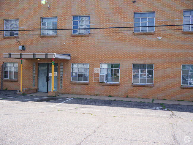 Cedar Wood Christian Academy's entrance is supported by pencil sculptures.