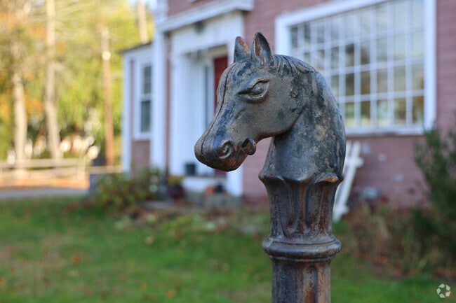 Horse tie ups sit outside Rowley antique shops.