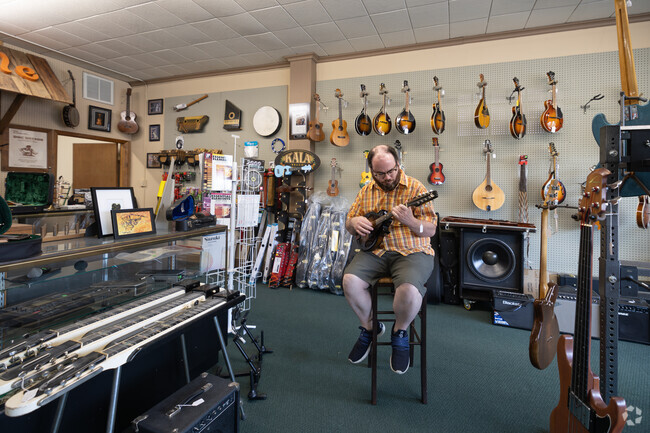 This gentleman is trying out a new mandolin at Fret N Fiddle, right in the Jefferson area.