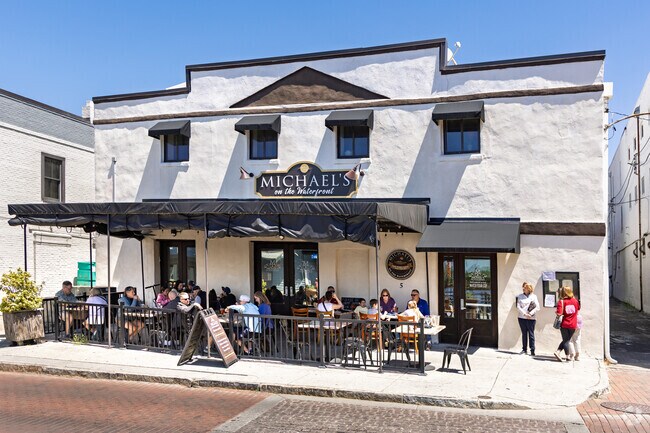 Residents from Carolina Heights enjoy people-watching from Michael’s covered patio.